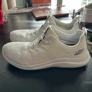 Skechers white slip on tennis shoes. Size 8.5